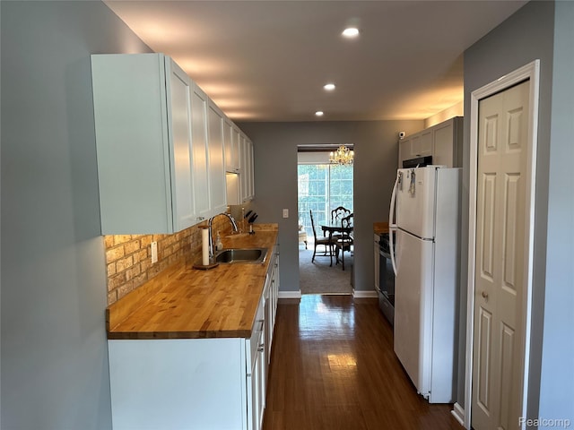 1437 Lantern Ln, Rochester Hills, MI 48306 - kitchen with freestanding refrigerator, wood counters, recessed lighting, a chandelier, and dark wood finished floors