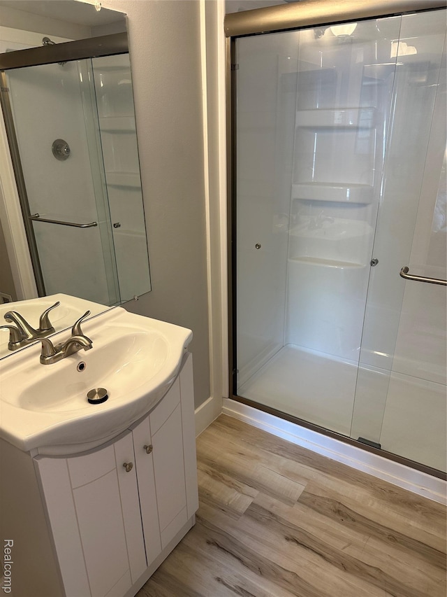 1437 Lantern Ln, Rochester Hills, MI 48306 - full bath with wood finished floors, vanity, and a shower stall