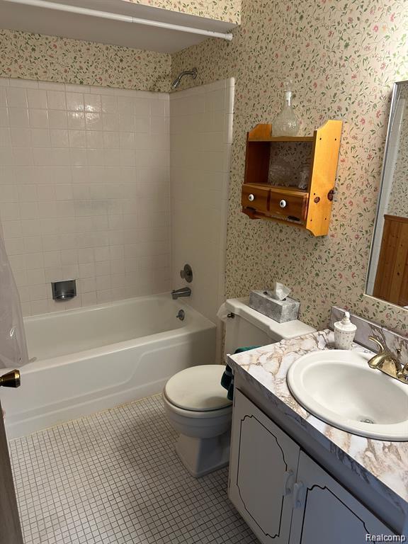 1437 Lantern Ln, Rochester Hills, MI 48306 - full bathroom featuring vanity, tub / shower combination, wallpapered walls, and tile patterned floors