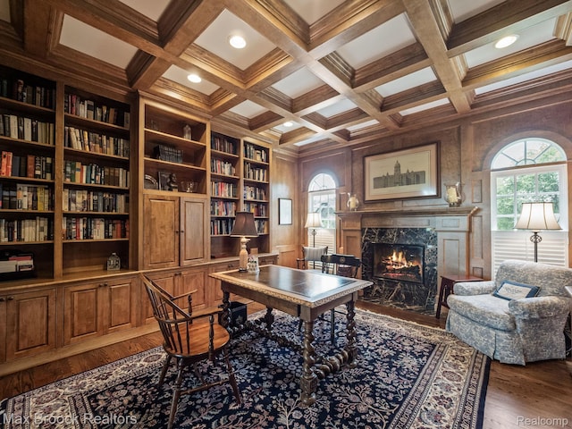 office space with dark wood-type flooring, coffered ceiling, a fireplace, beamed ceiling, and recessed lighting