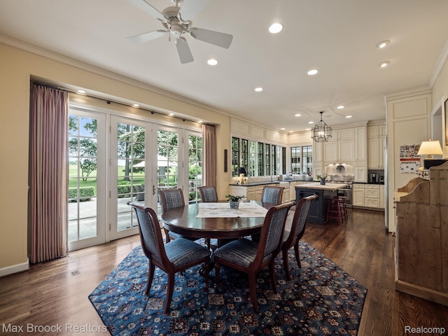 dining room featuring ornamental molding, recessed lighting, a ceiling fan, a chandelier, and dark wood finished floors