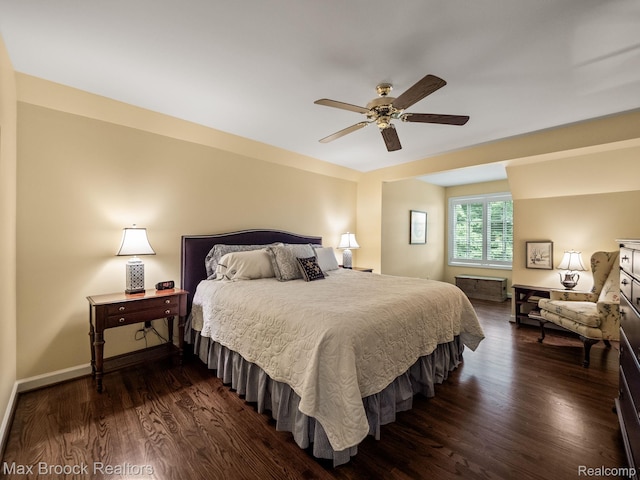 bedroom with dark wood-type flooring and a ceiling fan