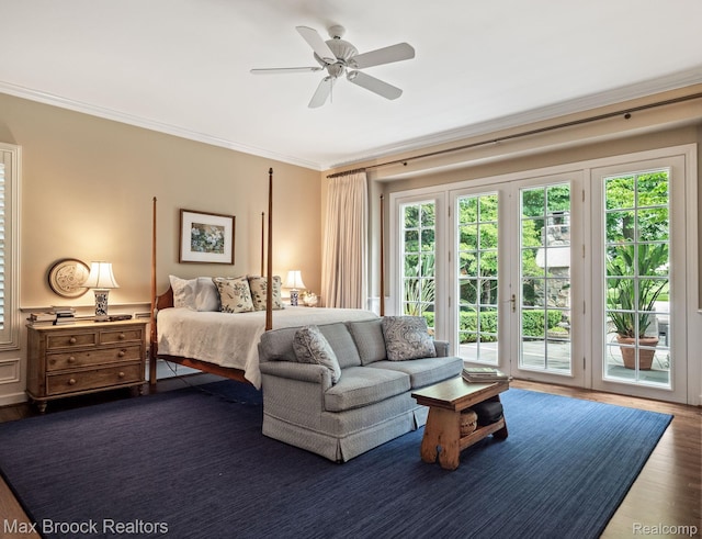 bedroom featuring access to exterior, ornamental molding, dark wood-type flooring, and a ceiling fan