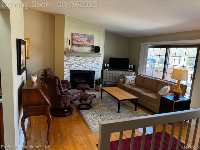 22208 Pondview, Novi, MI 48375 - living room with wood-type flooring and a fireplace