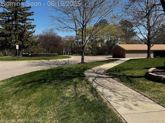 22208 Pondview, Novi, MI 48375 - view of grassy yard with driveway