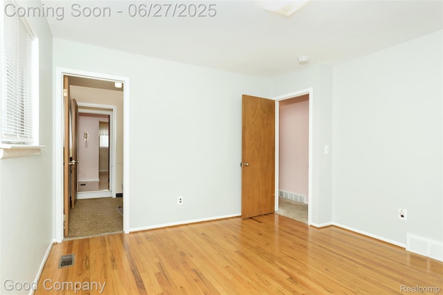 29035 Spoon Ave, Waterford, MI 48071 - unfurnished bedroom with light wood-type flooring and baseboards