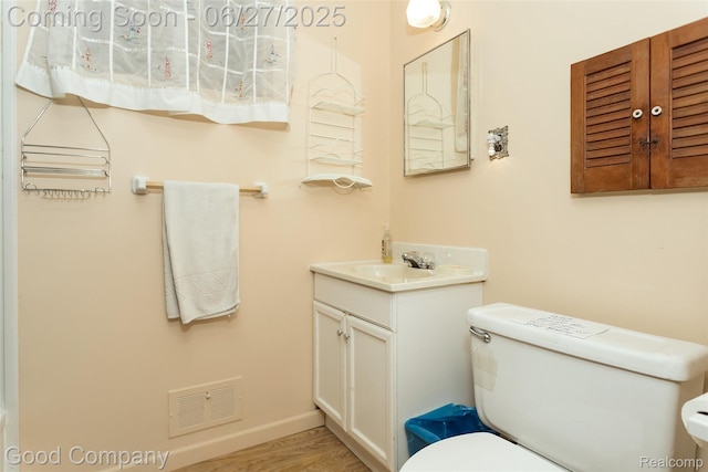 29035 Spoon Ave, Waterford, MI 48071 - half bath featuring vanity and wood finished floors