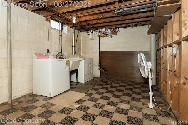 29035 Spoon Ave, Waterford, MI 48071 - below grade area with washer and clothes dryer and dark floors