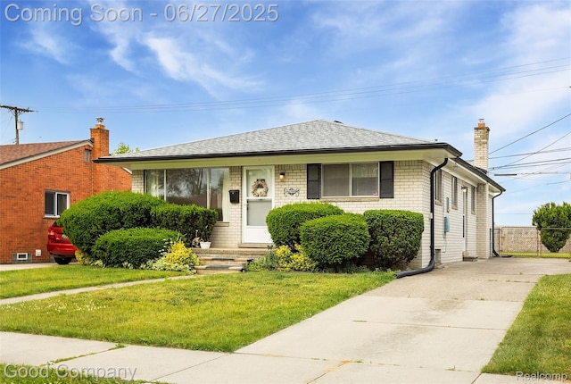 29035 Spoon Ave, Waterford, MI 48071 - bungalow with a chimney, concrete driveway, roof with shingles, and brick siding