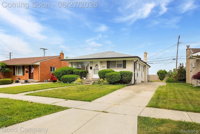 29035 Spoon Ave, Waterford, MI 48071 - bungalow-style home with brick siding, driveway, a chimney, and a front lawn