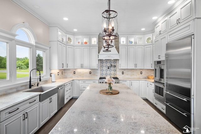 11694 Robinshire St, Temperance, MI 48182 - kitchen with stainless steel appliances, white cabinets, glass insert cabinets, tasteful backsplash, and recessed lighting