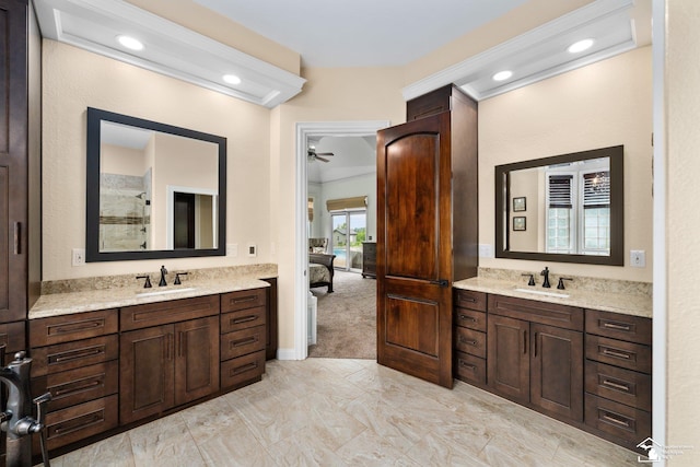 11694 Robinshire St, Temperance, MI 48182 - bathroom featuring two vanities, connected bathroom, a tile shower, recessed lighting, and marble look tile flooring