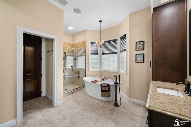 11694 Robinshire St, Temperance, MI 48182 - full bathroom featuring vanity, a shower stall, a freestanding tub, and a chandelier