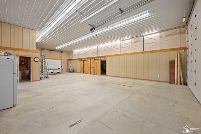 11694 Robinshire St, Temperance, MI 48182 - garage with freestanding refrigerator
