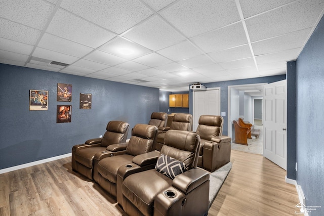 11694 Robinshire St, Temperance, MI 48182 - cinema room with a drop ceiling, light wood-style floors, and a textured wall