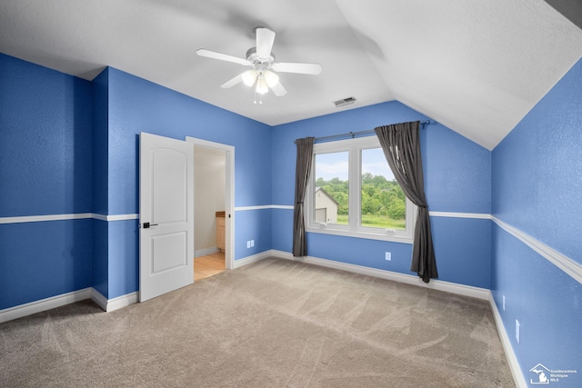 11694 Robinshire St, Temperance, MI 48182 - unfurnished bedroom featuring carpet, lofted ceiling, and a ceiling fan
