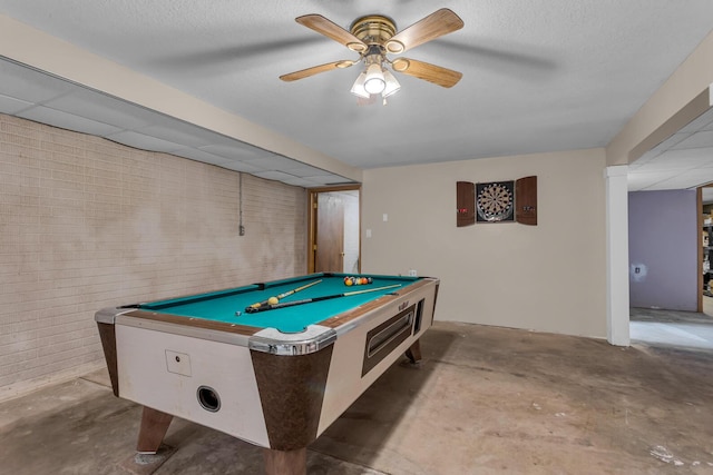 6824 Napoleon Rd, Jackson, MI 49201 - game room with concrete floors, billiards table, a ceiling fan, and a textured ceiling