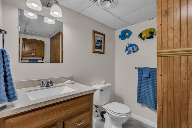6824 Napoleon Rd, Jackson, MI 49201 - bathroom with a drop ceiling, vanity, and tile patterned floors