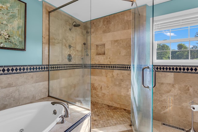 6824 Napoleon Rd, Jackson, MI 49201 - full bath featuring a stall shower, a whirlpool tub, and tile walls