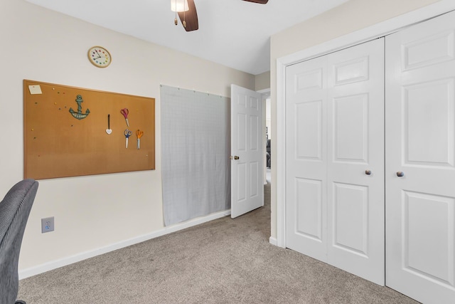 6824 Napoleon Rd, Jackson, MI 49201 - unfurnished bedroom with carpet, a closet, and a ceiling fan