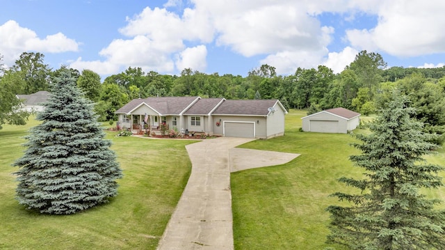 6824 Napoleon Rd, Jackson, MI 49201 - view of front of property with a front yard, covered porch, concrete driveway, and an outbuilding
