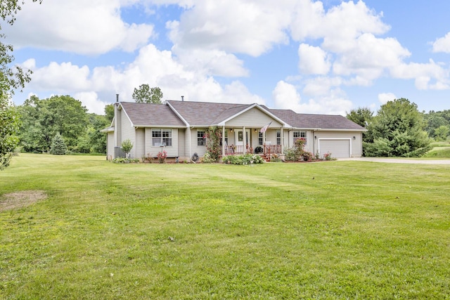 6824 Napoleon Rd, Jackson, MI 49201 - single story home featuring a porch, an attached garage, driveway, and a front yard