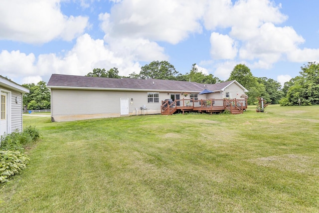 6824 Napoleon Rd, Jackson, MI 49201 - back of house with a wooden deck and a yard