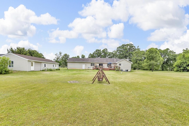 6824 Napoleon Rd, Jackson, MI 49201 - view of grassy yard featuring a deck