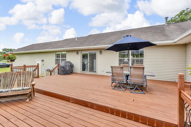 6824 Napoleon Rd, Jackson, MI 49201 - wooden terrace featuring outdoor dining area and grilling area