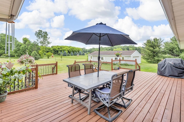 6824 Napoleon Rd, Jackson, MI 49201 - deck with outdoor dining space, a grill, and a yard