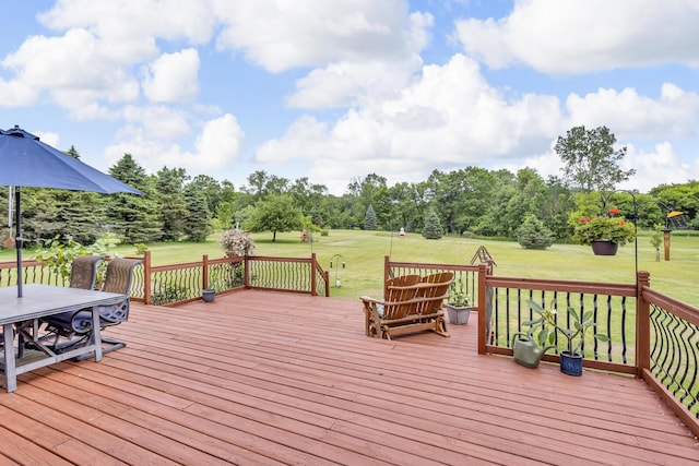 6824 Napoleon Rd, Jackson, MI 49201 - wooden deck with a lawn, view of scattered trees, and outdoor dining area