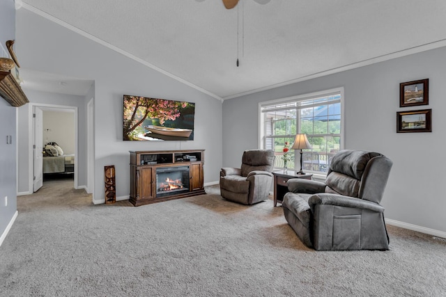 6824 Napoleon Rd, Jackson, MI 49201 - living room featuring crown molding, carpet flooring, a glass covered fireplace, vaulted ceiling, and a ceiling fan
