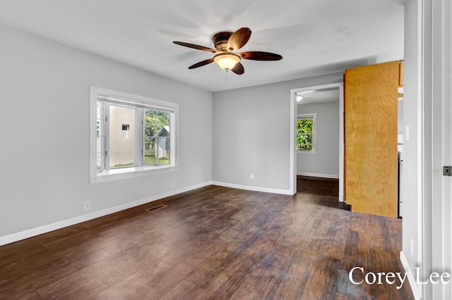 413 W Riverside Dr, Ionia, MI 48846 - spare room with healthy amount of natural light, a ceiling fan, and wood finished floors