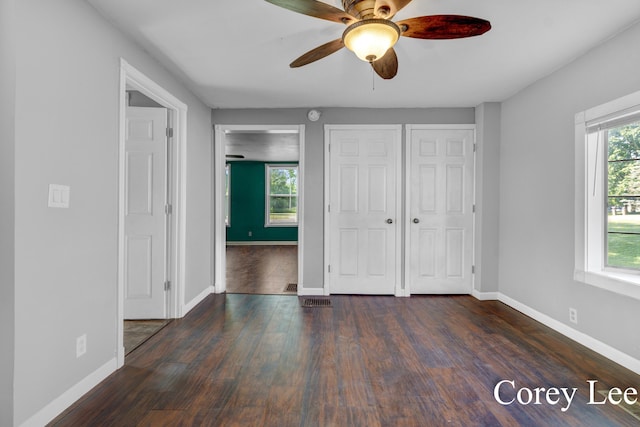 413 W Riverside Dr, Ionia, MI 48846 - unfurnished bedroom featuring wood finished floors and ceiling fan