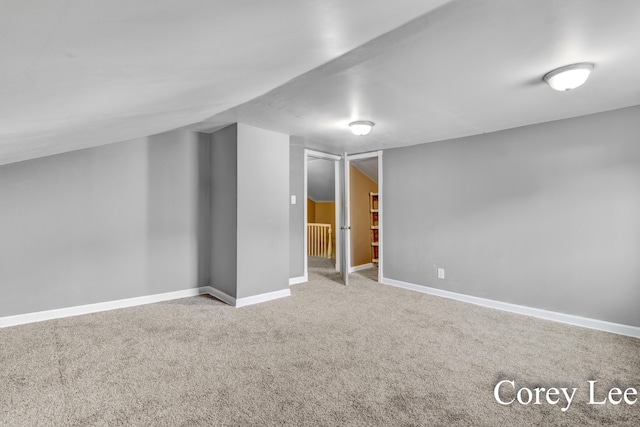 413 W Riverside Dr, Ionia, MI 48846 - below grade area with carpet and baseboards