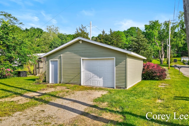 413 W Riverside Dr, Ionia, MI 48846 - detached garage with dirt driveway