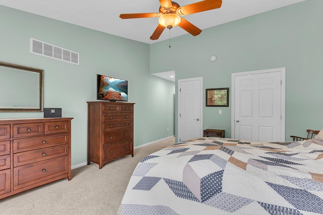 4268 Fairway Ln, Jackson, MI 49201 - bedroom with light carpet, a ceiling fan, and high vaulted ceiling