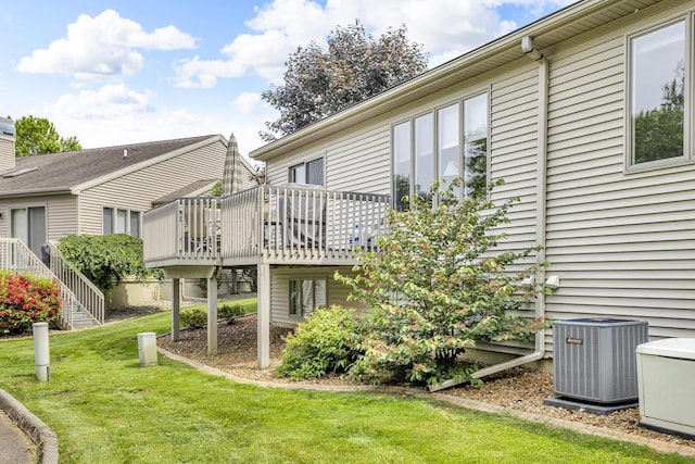 4268 Fairway Ln, Jackson, MI 49201 - back of house featuring a wooden deck, a yard, and stairs