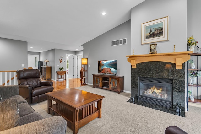 4268 Fairway Ln, Jackson, MI 49201 - carpeted living area featuring a fireplace, recessed lighting, and vaulted ceiling