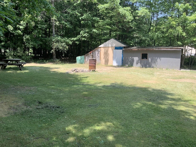 8356 Constitution Blvd, Cadillac, MI 49601 - view of grassy yard featuring an outdoor structure