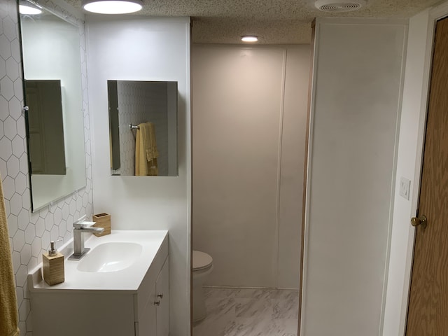 8356 Constitution Blvd, Cadillac, MI 49601 - bathroom featuring vanity and marble look tiles