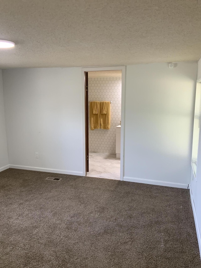 8356 Constitution Blvd, Cadillac, MI 49601 - unfurnished room featuring a textured ceiling and carpet