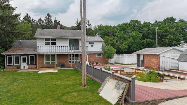 57081 M 51 S, Dowagiac, MI 49047 - rear view of house with brick siding, an outbuilding, a chimney, and a balcony