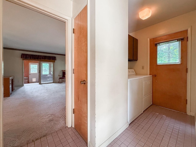 57081 M 51 S, Dowagiac, MI 49047 - washroom featuring washing machine and clothes dryer, cabinet space, light tile patterned flooring, ornamental molding, and light colored carpet
