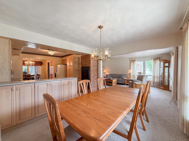 57081 M 51 S, Dowagiac, MI 49047 - dining room featuring a chandelier and light carpet