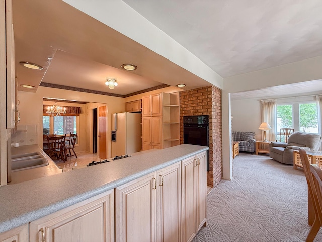 57081 M 51 S, Dowagiac, MI 49047 - kitchen featuring oven, white refrigerator with ice dispenser, a chandelier, light brown cabinetry, and stovetop