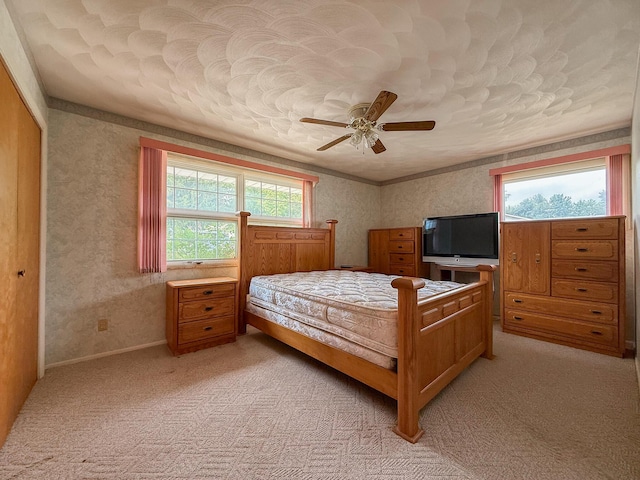 57081 M 51 S, Dowagiac, MI 49047 - bedroom featuring light colored carpet, ceiling fan, wallpapered walls, and a closet