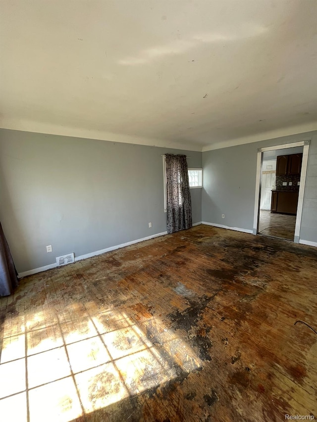 20569 Evergreen Rd, Detroit, MI 48219 - spare room with baseboards and hardwood / wood-style floors