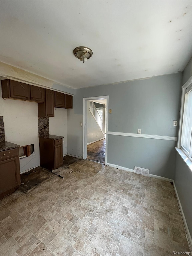 20569 Evergreen Rd, Detroit, MI 48219 - kitchen featuring baseboards and dark countertops