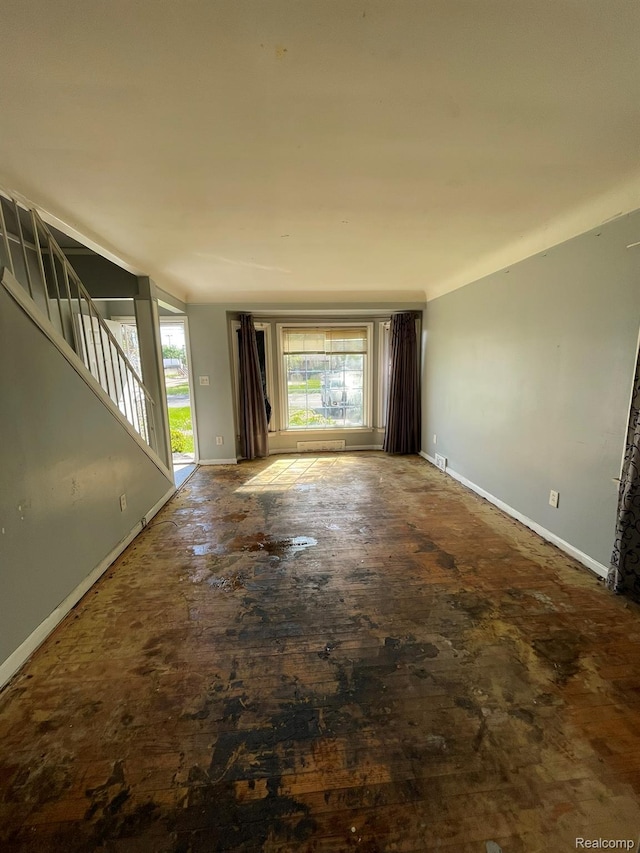 20569 Evergreen Rd, Detroit, MI 48219 - unfurnished living room with baseboards and stairway